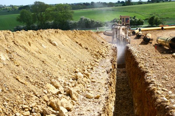 A trencher digging a trench